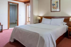 Postel nebo postele na pokoji v ubytování Hotel A.S. Sao Joao da Madeira