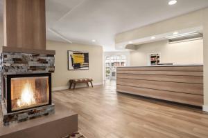 a living room with a fireplace in a building at Residence Inn by Marriott Palmdale Lancaster in Palmdale