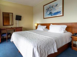 Postel nebo postele na pokoji v ubytování Hotel A.S. Sao Joao da Madeira