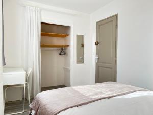 Łóżko lub łóżka w pokoju w obiekcie AptCityStay