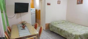 En eller flere senge i et værelse på Monoambiente Cuty Nakey