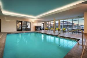 a large pool with blue water in a hotel at SpringHill Suites by Marriott Provo in Provo