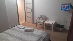 Posteľ alebo postele v izbe v ubytovaní Tumska Przystań