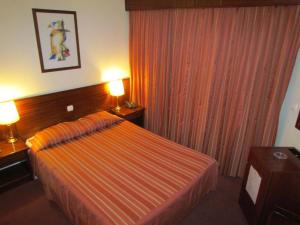 Postel nebo postele na pokoji v ubytování Hotel A.S. Sao Joao da Madeira