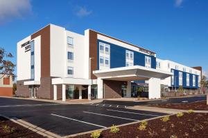 an empty parking lot in front of a building at SpringHill Suites by Marriott Medford Airport in Medford