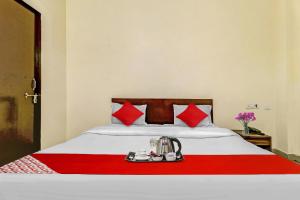 Een bed of bedden in een kamer bij Flagship Hotel Sg