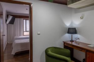 Postel nebo postele na pokoji v ubytování Hotel A.S. Sao Joao da Madeira