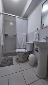 a bathroom with a toilet and a shower and a sink at Confortable and functional SUITE in MIRAFLORES ! in Lima