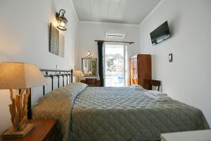 Postel nebo postele na pokoji v ubytování Delfini Hotel