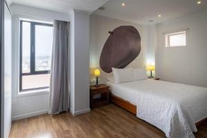 Postel nebo postele na pokoji v ubytování Hotel A.S. Sao Joao da Madeira