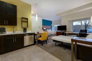 a kitchen and living room with a bed and a couch at Residence Inn by Marriott Pullman in Pullman