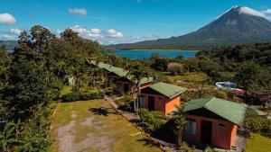an aerial view of a resort with a mountain in the background at Chateau Arenal Hotel & Restaurante in El Castillo de La Fortuna