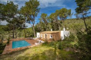 an external view of a house with a swimming pool at Can Font in Santa Eularia des Riu