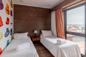 Postel nebo postele na pokoji v ubytování Hotel A.S. Sao Joao da Madeira
