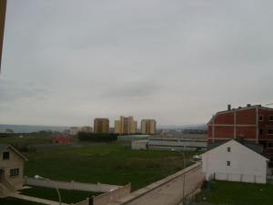 a view of a city with buildings in the background at Apartamento playa Llas in Foz