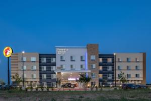 a large building with a parking lot in front of it at Fairfield Inn & Suites by Marriott Terrell in Terrell