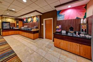 a restaurant with a food counter in a room at Fairfield Inn and Suites by Marriott Weatherford in Weatherford