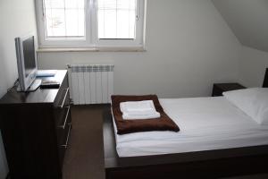 Postel nebo postele na pokoji v ubytování Marina Górkło - Żurawi Kąt