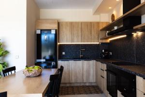 A kitchen or kitchenette at Isla Luxury Apartments - Private Hot tub - 100m from beach