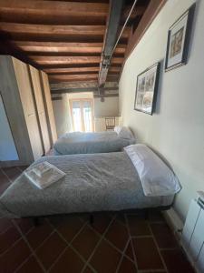 A bed or beds in a room at La canongia