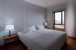 Postel nebo postele na pokoji v ubytování Hotel A.S. Sao Joao da Madeira