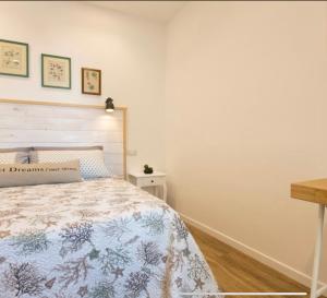 Voodi või voodid majutusasutuse Catalogna10 Rooms toas