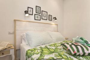 Voodi või voodid majutusasutuse Catalogna10 Rooms toas