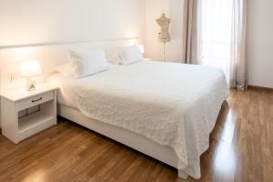 Postel nebo postele na pokoji v ubytování Hotel A.S. Sao Joao da Madeira
