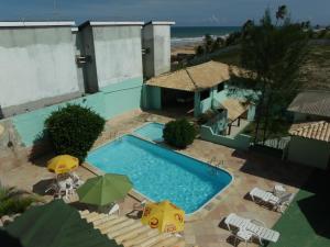 Bazén v ubytování Hotel Pousada Oasis nebo v jeho okolí