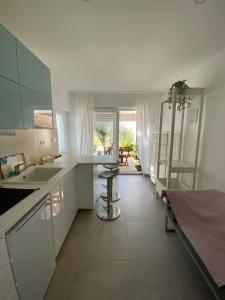 a kitchen with a sink and a counter top at Lovely Suite in Šibenik