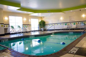 a large swimming pool in a hotel room at Fairfield Inn and Suites by Marriott Bartlesville in Bartlesville