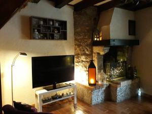 TV a/nebo společenská místnost v ubytování Ste ENIMIE GITE terrasse privative vue imprenable
