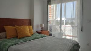 A bed or beds in a room at Precioso alojamiento junto al Mediterráneo