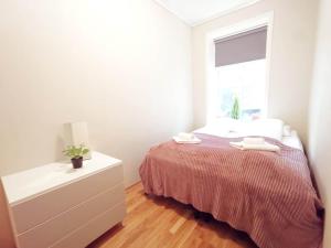 Cama ou camas em um quarto em Håkonsgaten