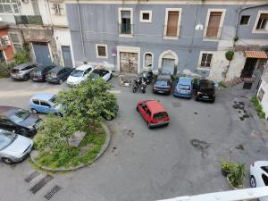 an aerial view of cars parked in a parking lot at Pantaleone Holiday House in Catania