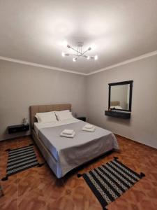En eller flere senger på et rom på Antonela Sunshine Apartment by Corfu Escapes