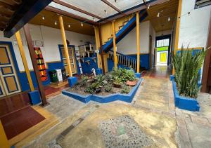 a room with plants in the middle of a building at Hostal Ciudad de Segorbe in Salento