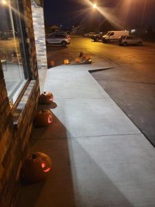 a group of pumpkins sitting on the side of a building at SureStay by Best Western Glendive Yellowstone River in Glendive