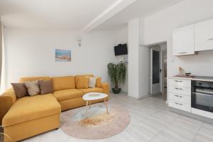 a living room with a couch and a table at Apartment Aleksic in Kotor