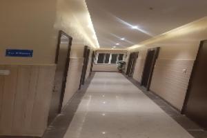 a hallway of a building with doors and a hallway sidx sidx at OYO Hotel Data Shree in Udaipur