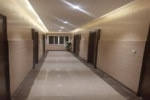 a hallway of a building with two garage doors at OYO Hotel Data Shree in Udaipur