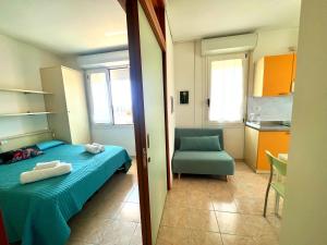 Postel nebo postele na pokoji v ubytování Residence Frontemare