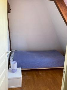 Łóżko lub łóżka w pokoju w obiekcie Gîte de charme à la campagne
