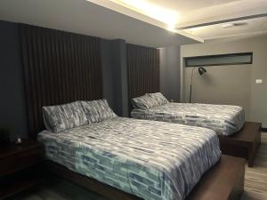 Ein Bett oder Betten in einem Zimmer der Unterkunft Huasteca Em suites