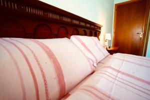 A bed or beds in a room at Affittacamere Umberto&Marisa