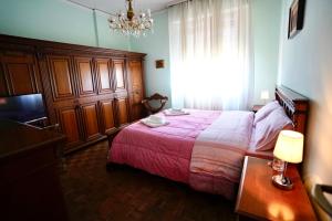 A bed or beds in a room at Affittacamere Umberto&Marisa