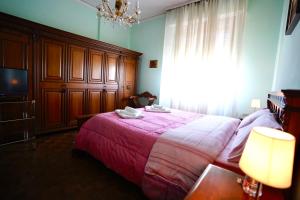 A bed or beds in a room at Affittacamere Umberto&Marisa
