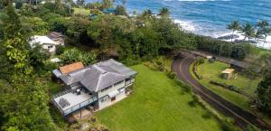 an aerial view of a house next to the ocean at Hana Homestead in Hana