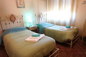 A bed or beds in a room at Affittacamere Umberto&Marisa