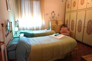 A bed or beds in a room at Affittacamere Umberto&Marisa